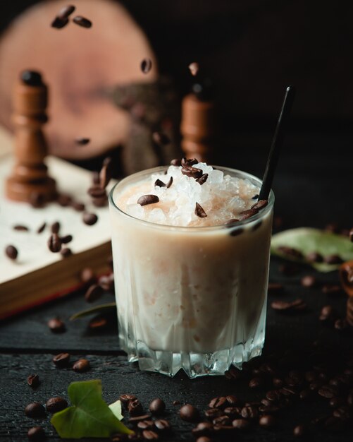 Milky cocktail with minced ice and chocolate chips.