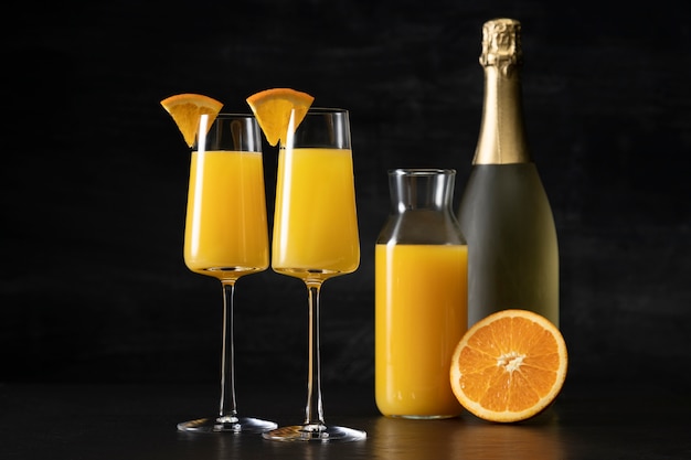 Mimosa cocktail glasses with orange slices