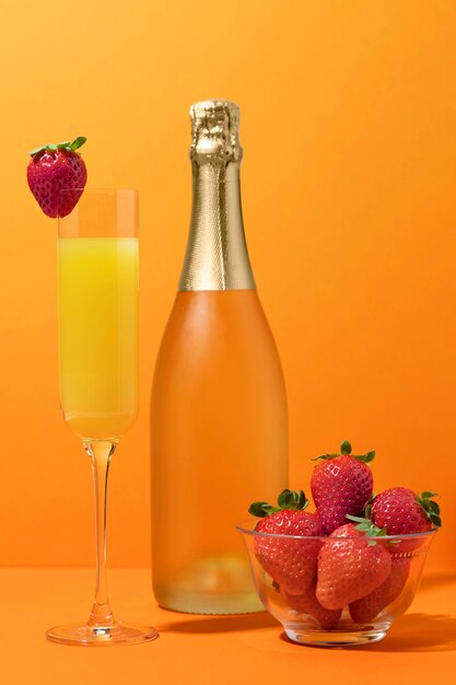 Mimosa cocktail and strawberries