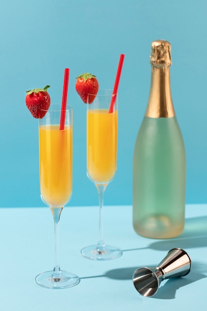 Free Photo mimosa cocktails with blue background