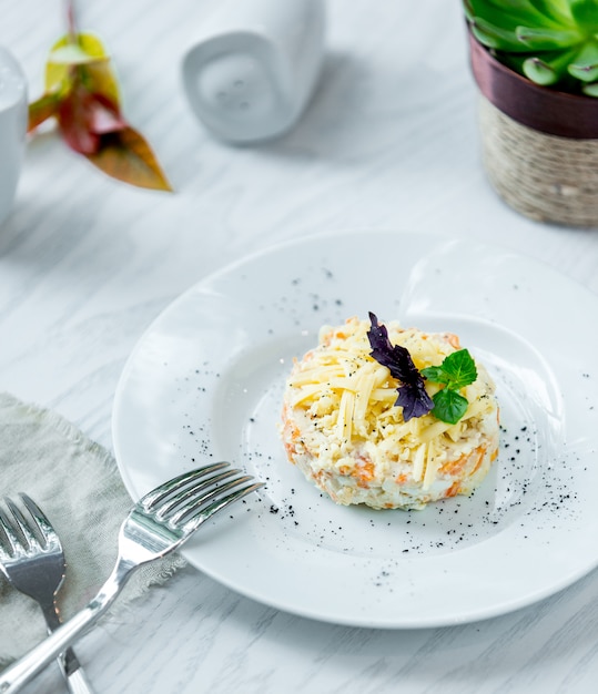 Mimosa salad with chopped parmesan and herbs.