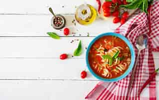 Free photo minestrone, italian vegetable soup with pasta. tomatoes soup. vegan food. top view. flat lay.