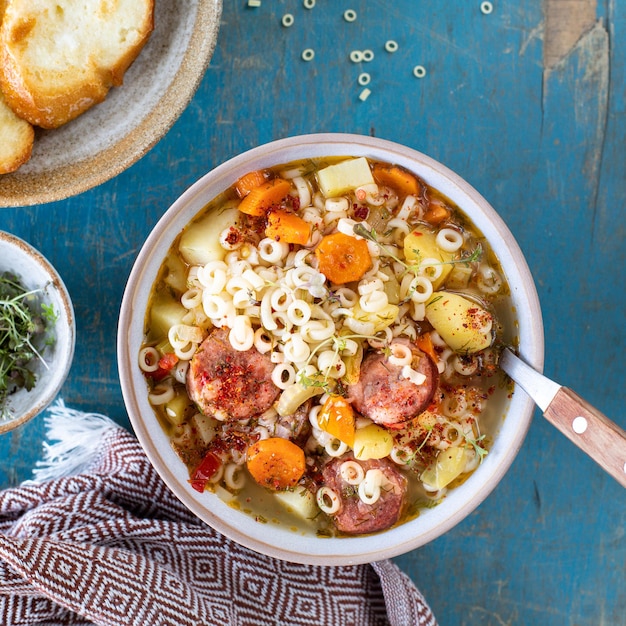 Free Photo minestrone soup in a pan on a light table top view italian soup with pasta and seasonal vegetables delicious vegetarian food concept