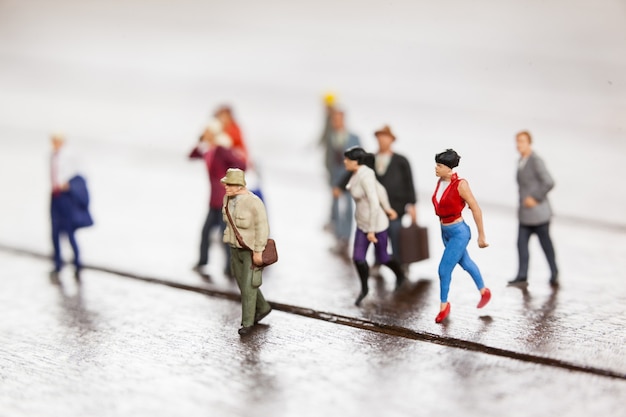 Miniature people travelling