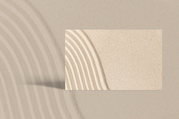 Free Photo minimal business card with sand texture in wellness concept