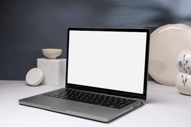 Minimal laptop and ceramic pots