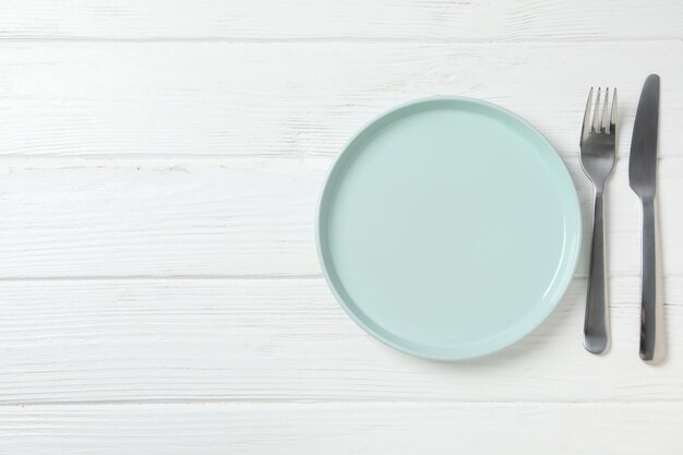 Minimal table setting with blank dish space for text