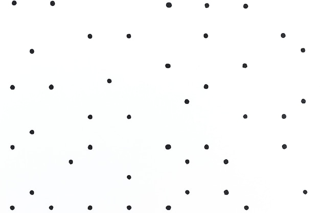 Minimal white background with black polka dot pattern