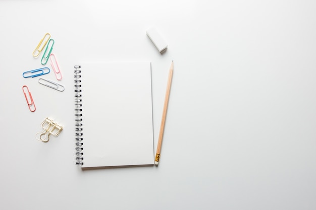 Free Photo minimal work space - creative flat lay photo of workspace desk with sketchbook and wooden pencil on copy space white background. top view , flat lay photography.