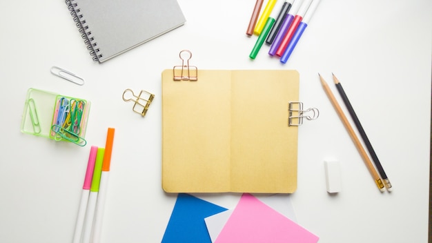 Minimal work space - Creative flat lay photo of workspace desk with sketchbook and wooden pencil on copy space white background. Top view , flat lay photography.