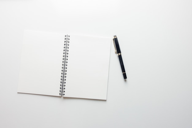 Free photo minimal work space - creative flat lay photo of workspace desk with sketchbook and wooden pencil on copy space white background. top view , flat lay photography.