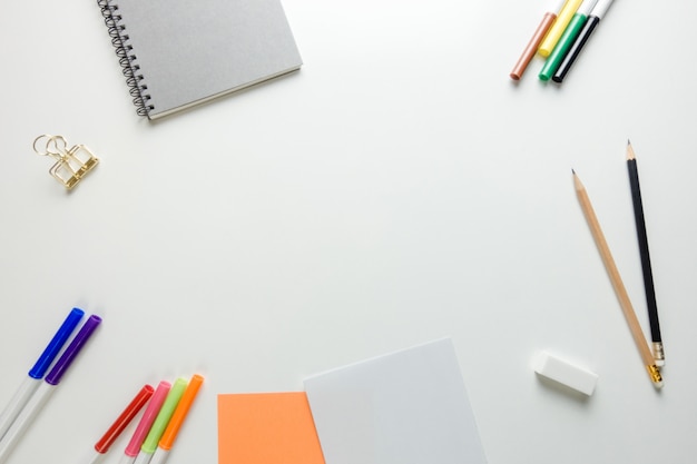 Minimal work space - Creative flat lay photo of workspace desk with sketchbook and wooden pencil on copy space white background. Top view , flat lay photography.