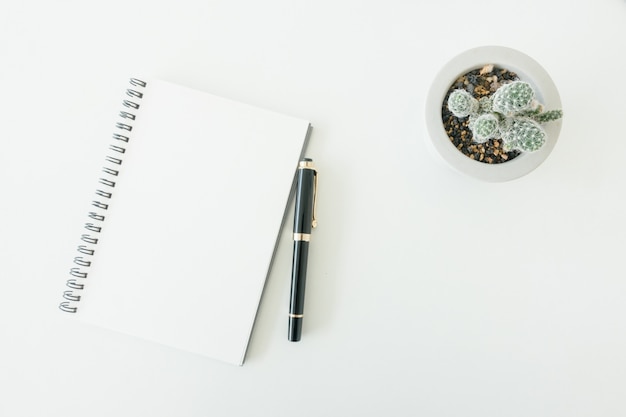 Minimal work space - Creative flat lay photo of workspace desk with sketchbook and wooden pencil on copy space white background. Top view , flat lay photography.