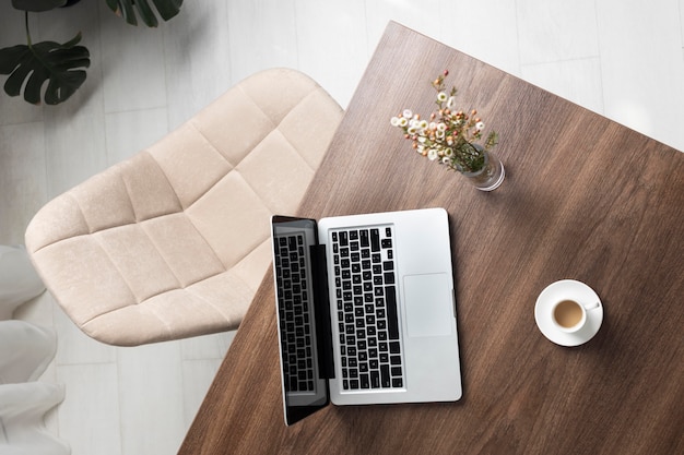 Minimalist desk arrangement with laptop top view