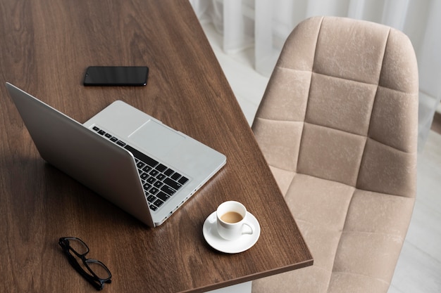 Minimalist desk arrangement with laptop