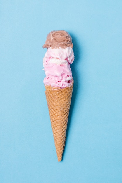 Minimalist layers of ice cream and brown cone