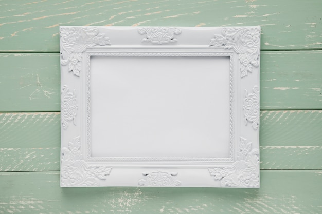 Minimalist ornamental frame on wooden background