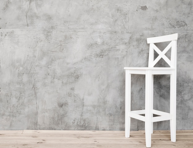 Minimalist white and stool with concrete panels