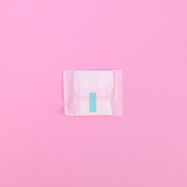 Minimalist wrapped pad on pink background