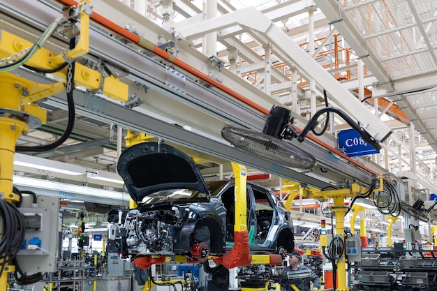 Free photo minsk belarus dec 15 2021 car bodies are on assembly line factory for production of cars modern automotive industry a car being checked before being painted in a hightech enterprise