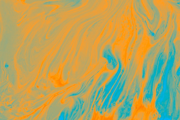 Free Photo mix of bright orange and blue paint