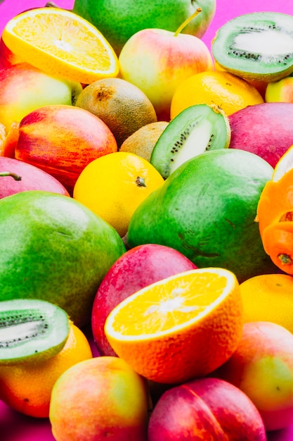 Mixed colorful whole and slices fruits