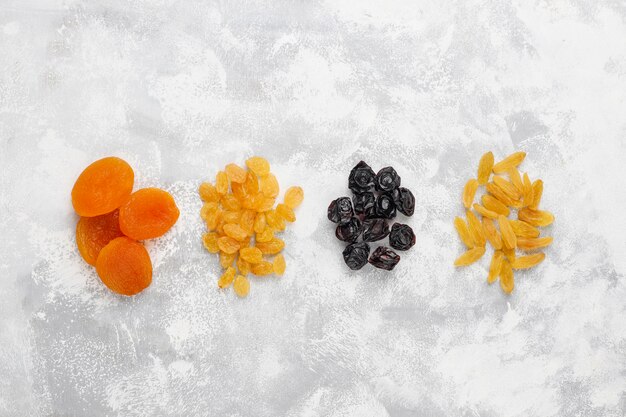 Mixed of dried fruits ,apricots, grapes,plums on light 