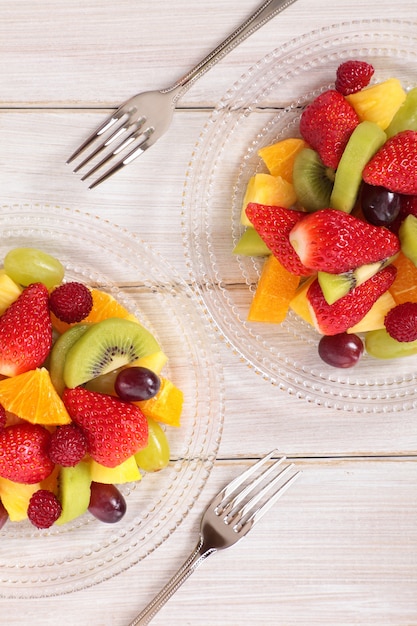 Free Photo mixed fresh fruits salad with forks