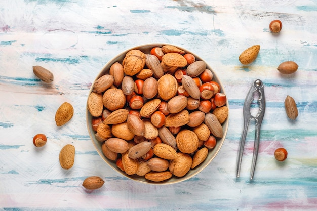 Free photo mixed organic nuts with shell.