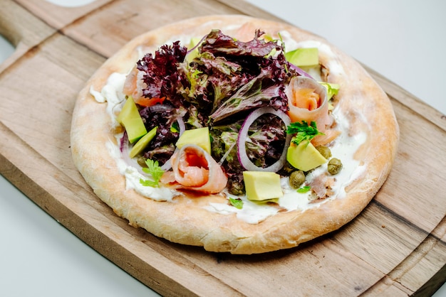 Mixed salad topped on round bread