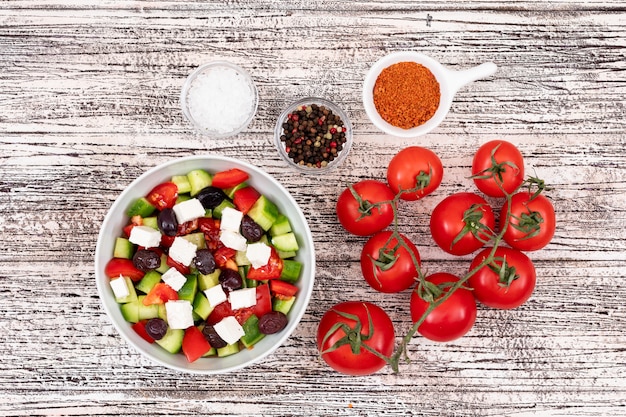 mixed vegetable salad in white bowl cheese cucumber tomato olive