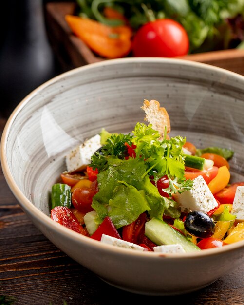 Mixed vegetable salad with feta cheese greens and olives