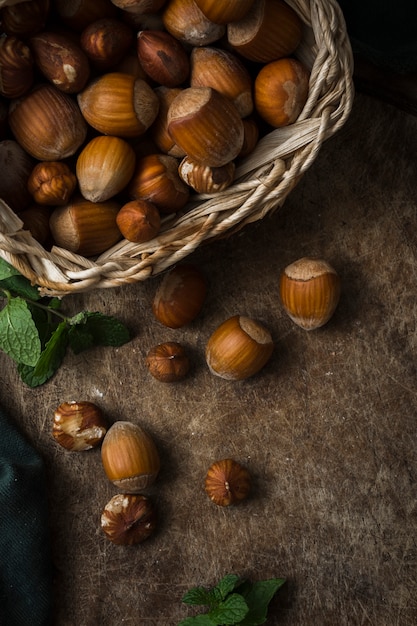 Free photo mixture of organic hazelnuts on the table