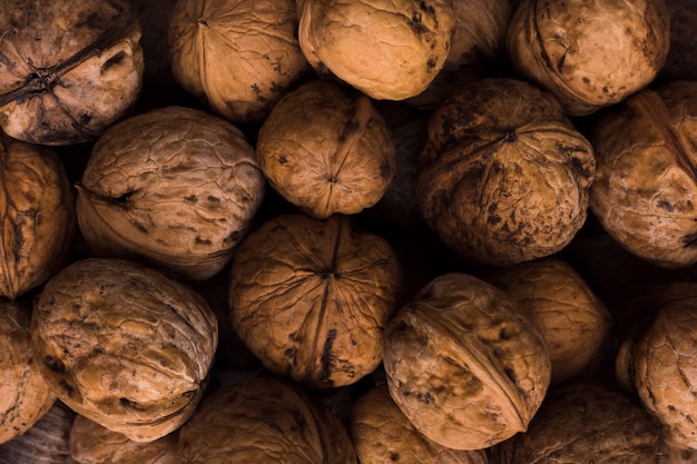 Free photo mixture of organic walnuts with close-up