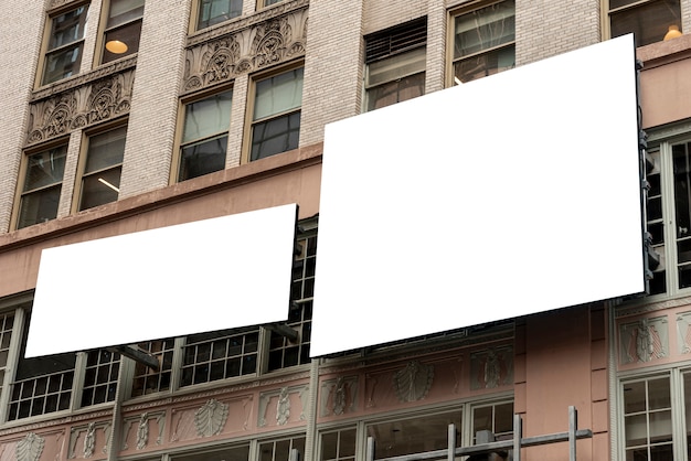 Free photo mock-up billboards on a city building