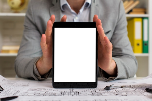 Mock-up businessman holding tablet