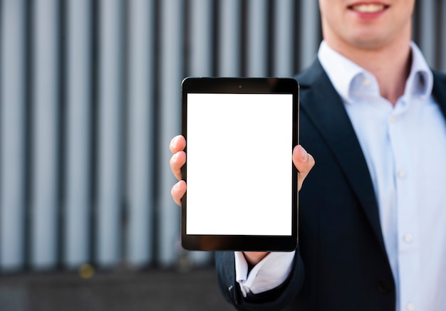 Free photo mock-up businessman holding tablet