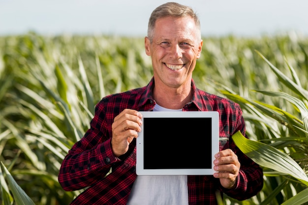 Free photo mock-up middle age man in a field