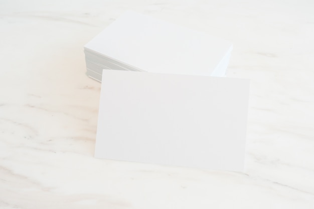 Mockup of blank business cards stack on marble table background. Template for ID. For design presentations and portfolios.