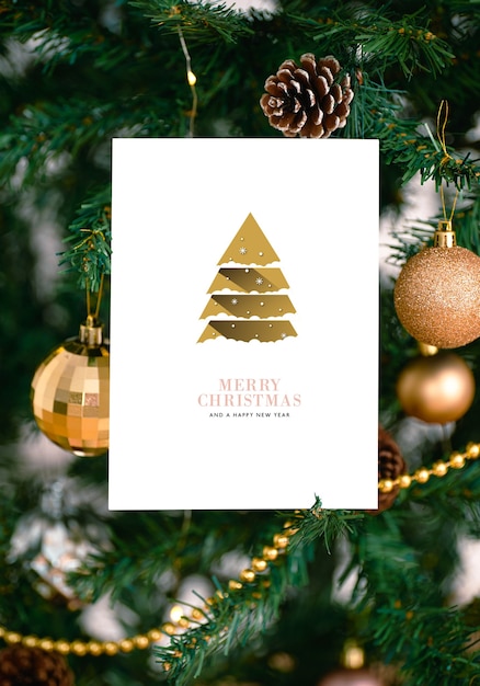 Free photo mockup christmas greeting card for invitation design on christmas tree background