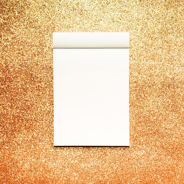 Free Photo mockup notebook with gold glitter background