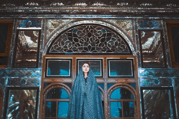 Free Photo model in blue dress in a historical mosque