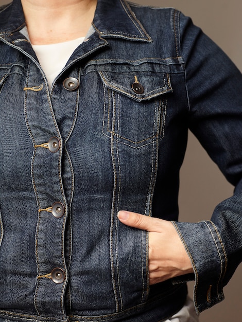 Model details wearing blue denim jacket