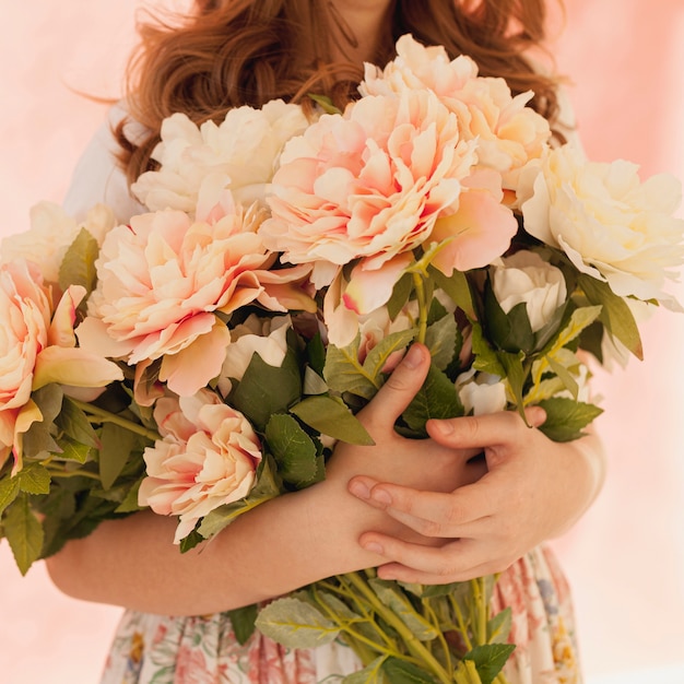 Model holding spring flower bouquet