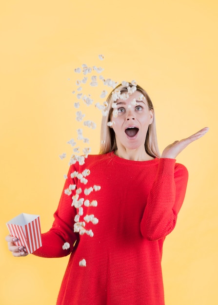 Free photo model slipping bag of popcorn