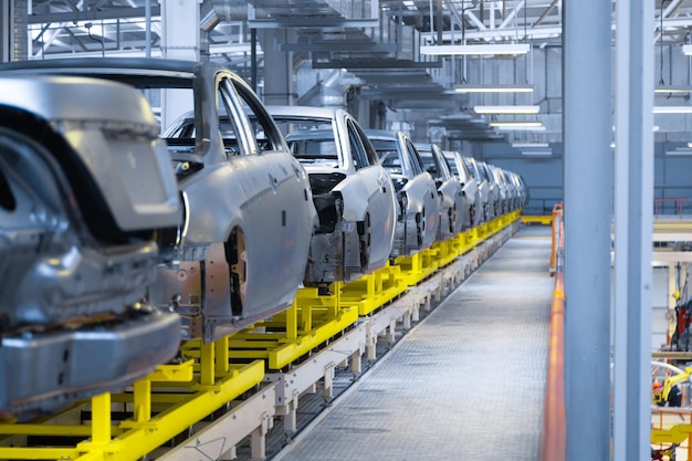 Modern automobile production line automated production equipment Shop for the Assembly of new modern cars The way of Assembly of the car on the Assembly line at the plant