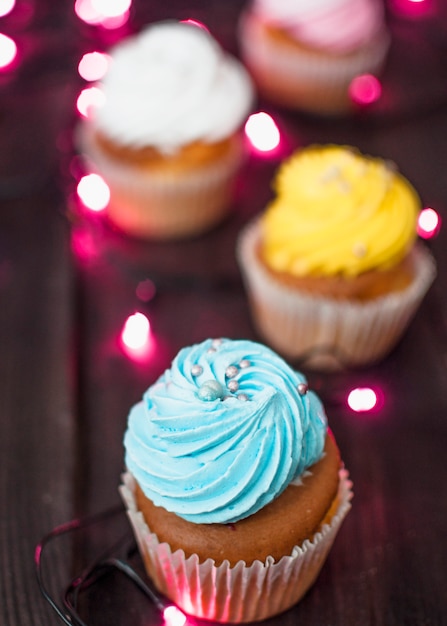 Free photo modern birthday composition with lovely cupcake