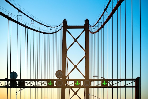 Modern bridge with road signs and traffic lights