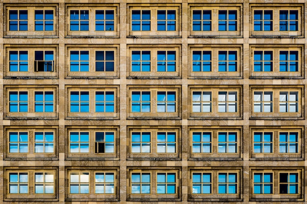 Free Photo modern brown building with blue glass windows and rusty aesthetics