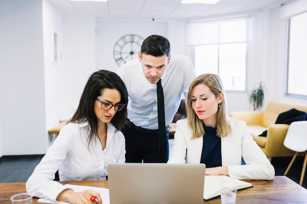 Modern business people at desk